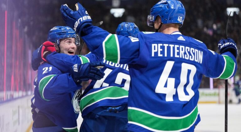 Nils Hoglander scores twice in Canucks win.