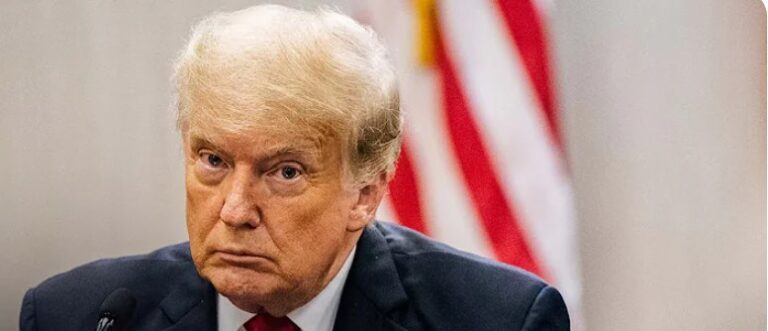 Trump Charges Reduced, but Racketeering Charges Remain