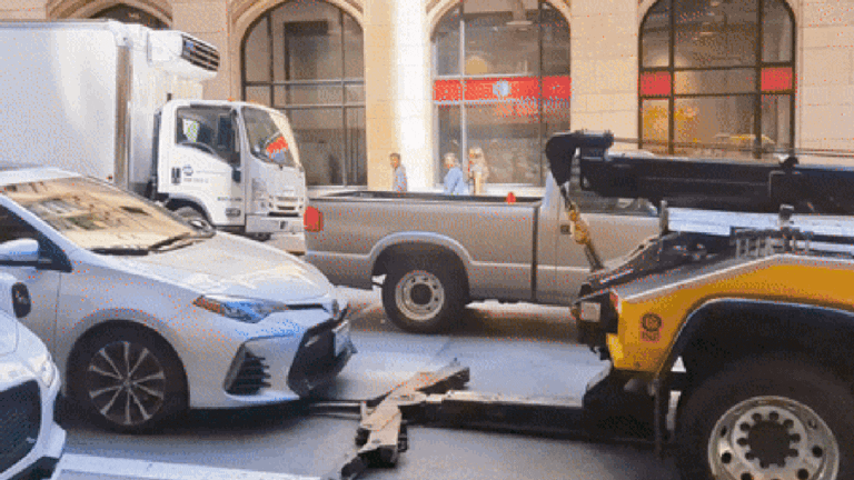 Scummy Tow Company Tries to Illegally Tow Occupied Car