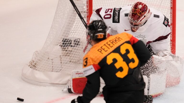 Germany secures playoff spot with 8-2 rout.